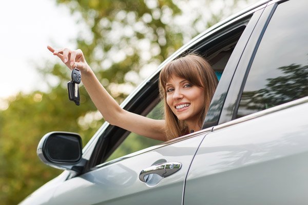 Happy woman with her keys